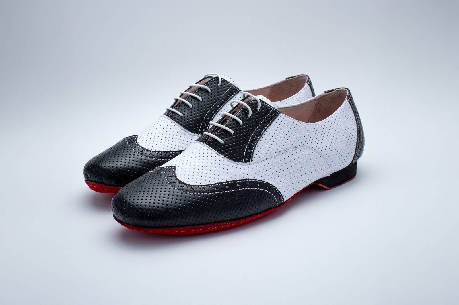 Mens 2 tone black and white perforated leather Mambo shoe with red suede bottom