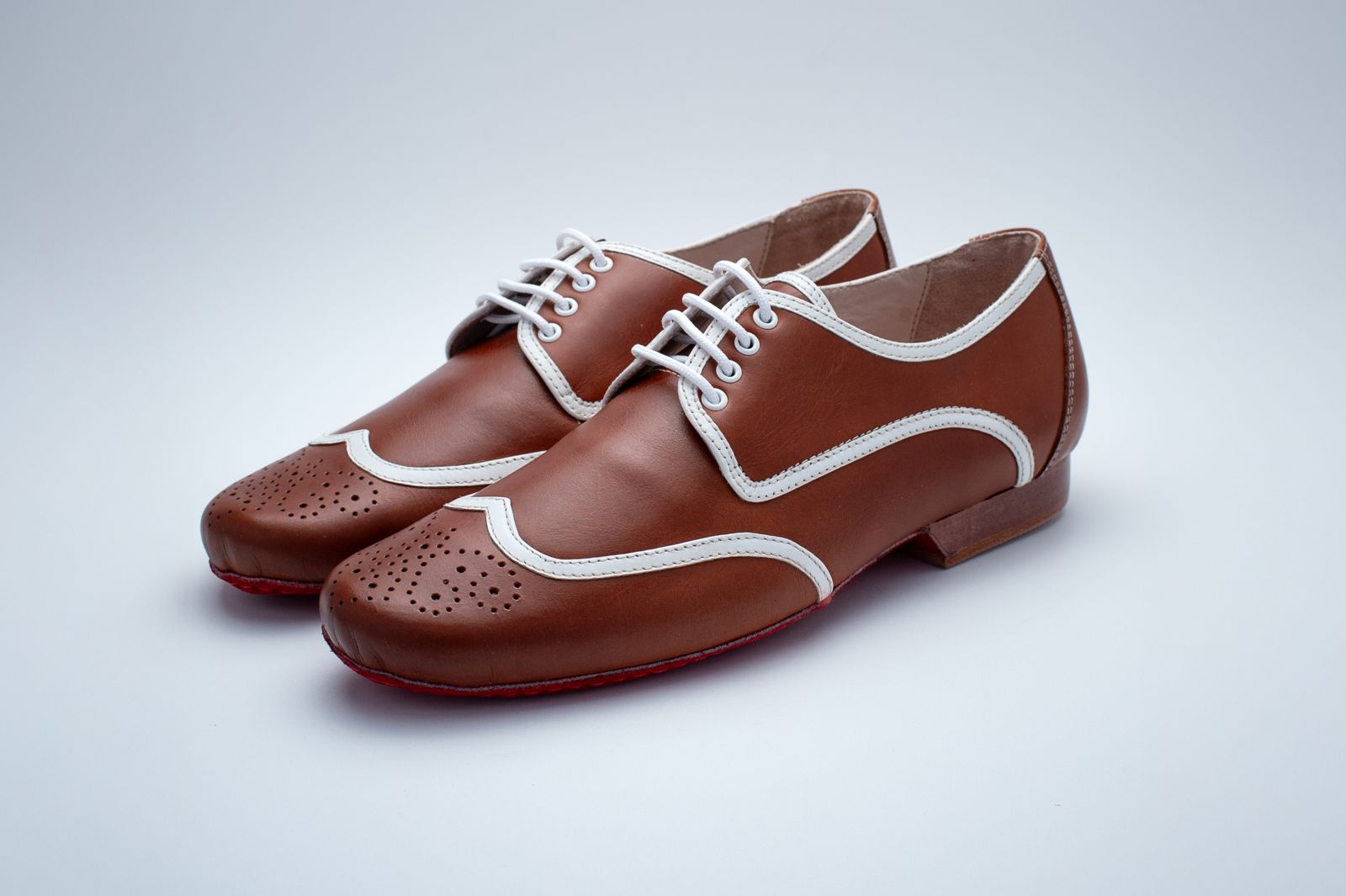 Mens cognac brown with white leather piping Mambo shoe and red suede bottom